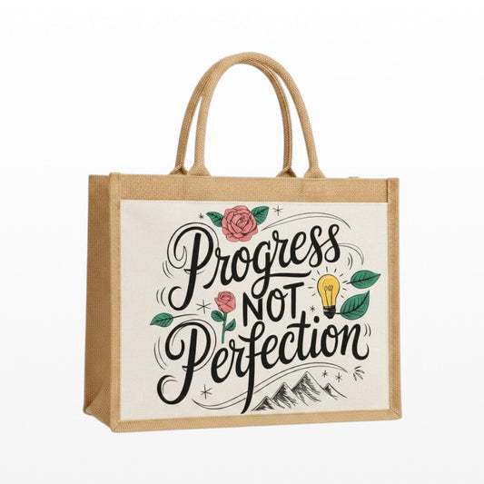 Jute bag with 'Progress Not Perfection' text and decorative elements on a white background