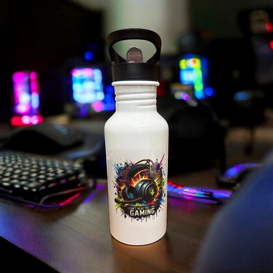 Metal water bottle with gaming design placed on a gaming desk
