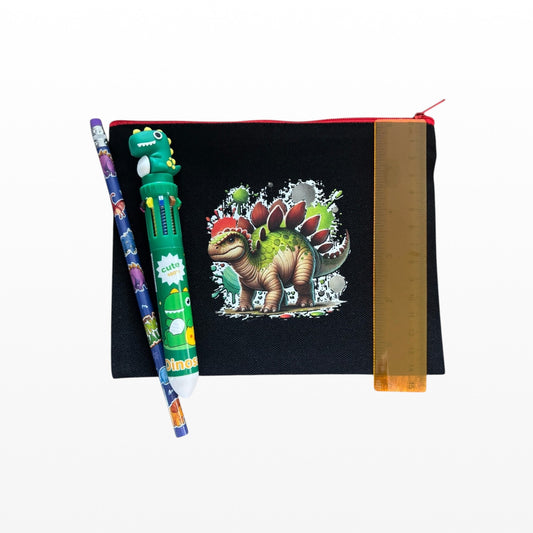 Black pouch with dinosaur design, green pen, and ruler on a white background