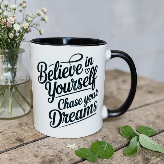 Illustrated Solutions Store white ceramic mug with black interior and handle, featuring black text: Believe in Yourself, Chase your Dreams.