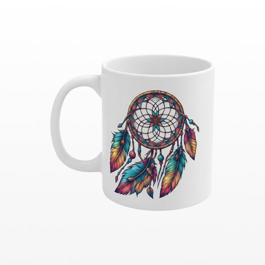 Illustrated Solutions Store 11oz ceramic mug with a colorful boho dreamcatcher design and turquoise center.
