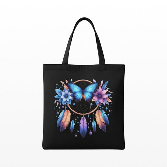 Illustrated Solutions Store spiritual canvas tote bag featuring a blue butterfly, dreamcatcher, flowers, and feathers.