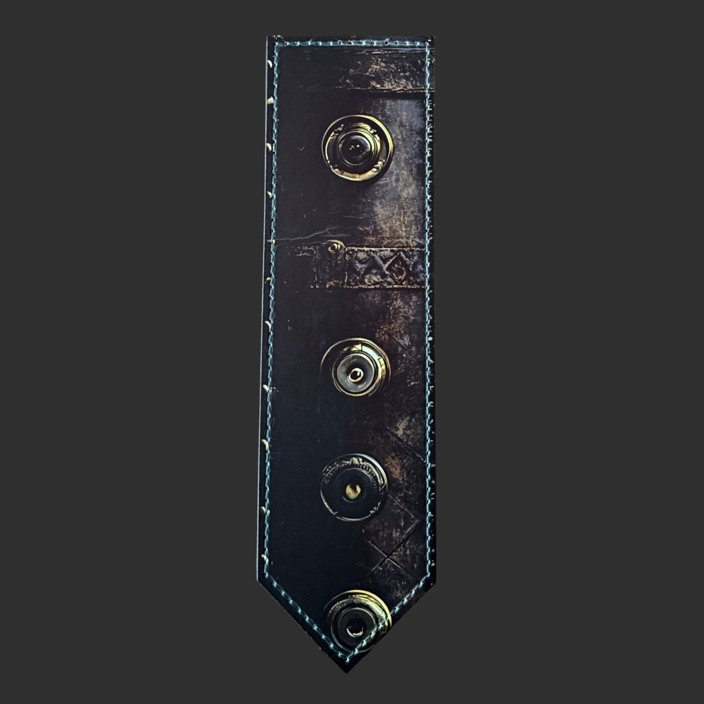 Illustrated Solutions Store steampunk leather bookmark with aged Victorian journal texture and brass rivet details.
