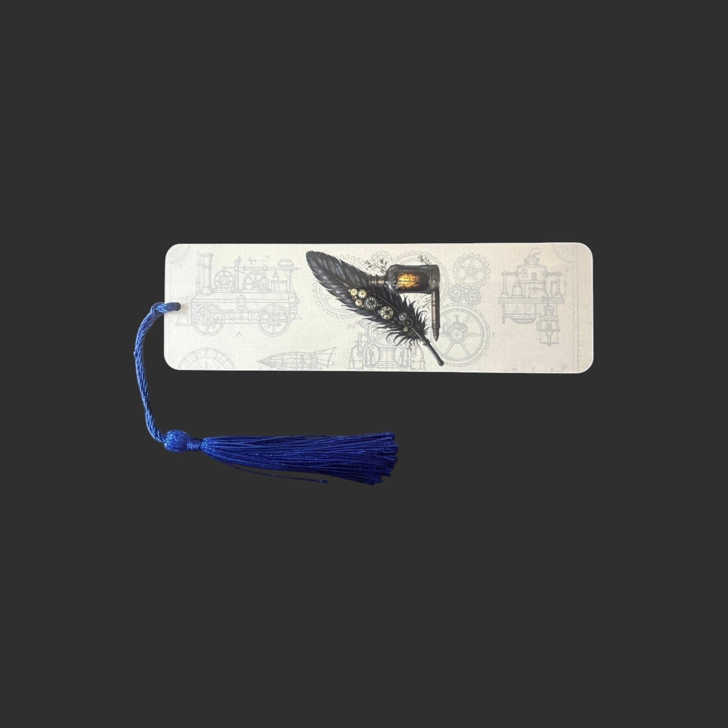 Illustrated Solutions Store steampunk metal bookmark featuring a black quill pen design and a blue tassel.