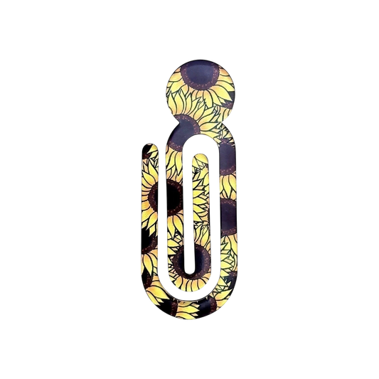 Illustrated Solutions Store acrylic book clip with a vibrant yellow and black sunflower pattern for journals