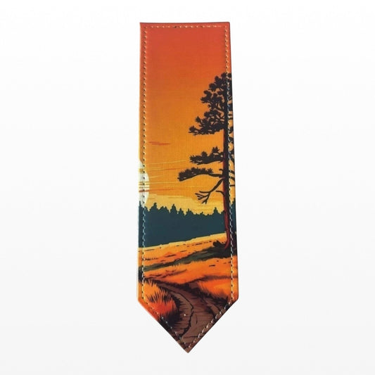Illustrated Solutions Store sunset path landscape PU leather bookmark with silhouetted tree and warm orange sky.