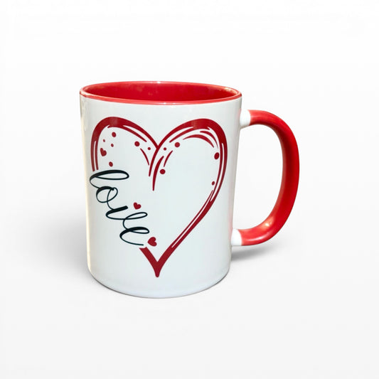 Illustrated Solutions Store white ceramic mug with red heart design and the word "love" inside. Red handle and rim.