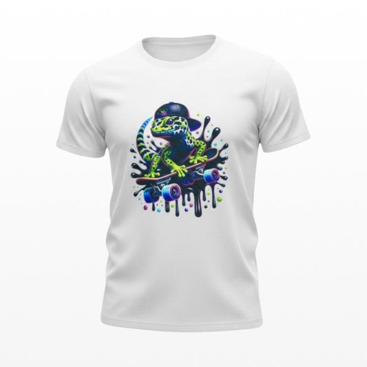 White kids t-shirt with a green gecko wearing a black baseball cap riding a skateboard.