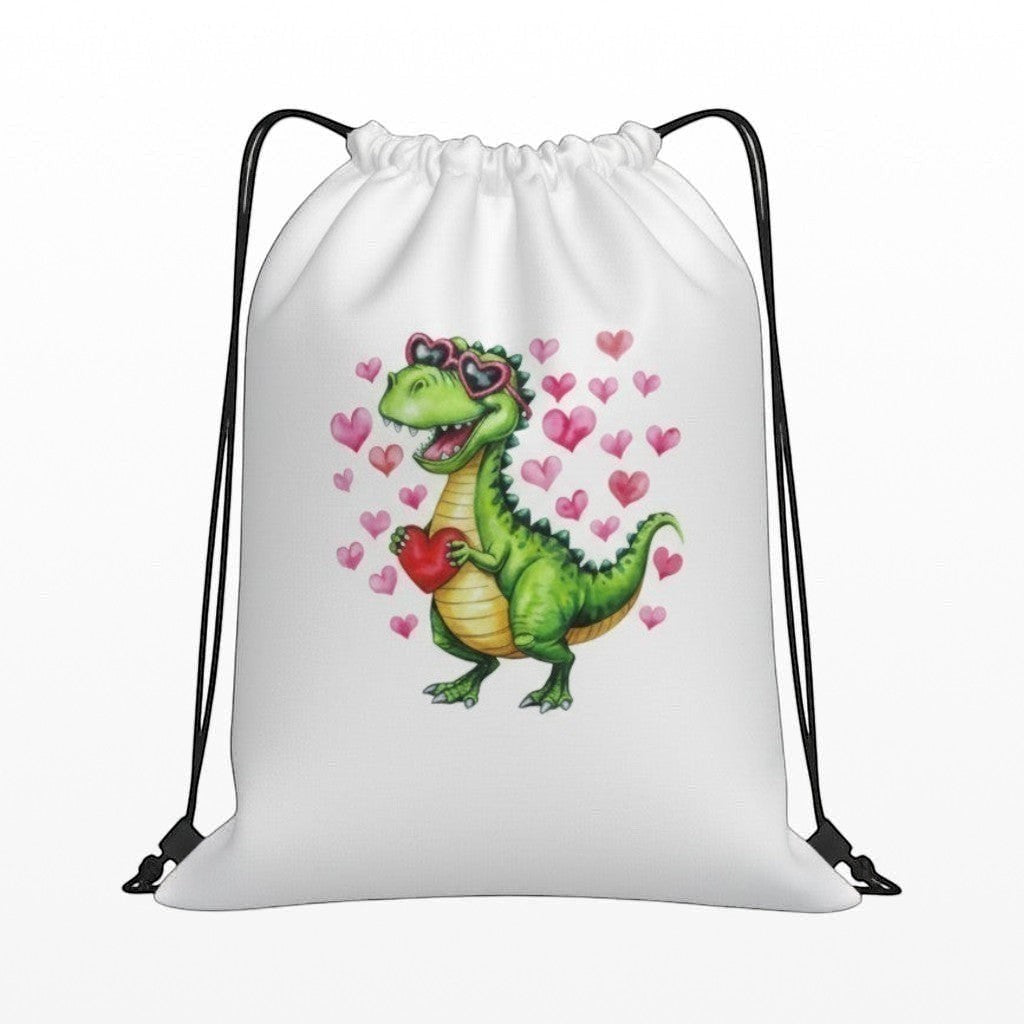 White drawstring bag with a green dinosaur and pink hearts design on a white background