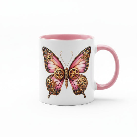 A white ceramic mug with a pink interior and handle, featuring a large pink and gold steampunk butterfly graphic on the front.