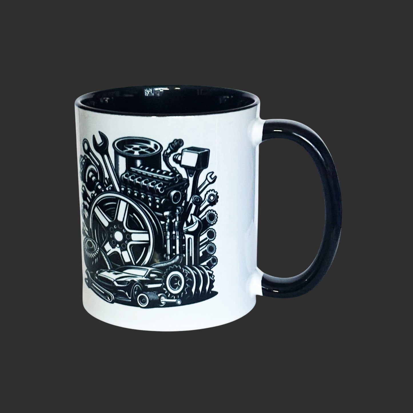 Two-tone black mug with mechanical engine design on a grey background