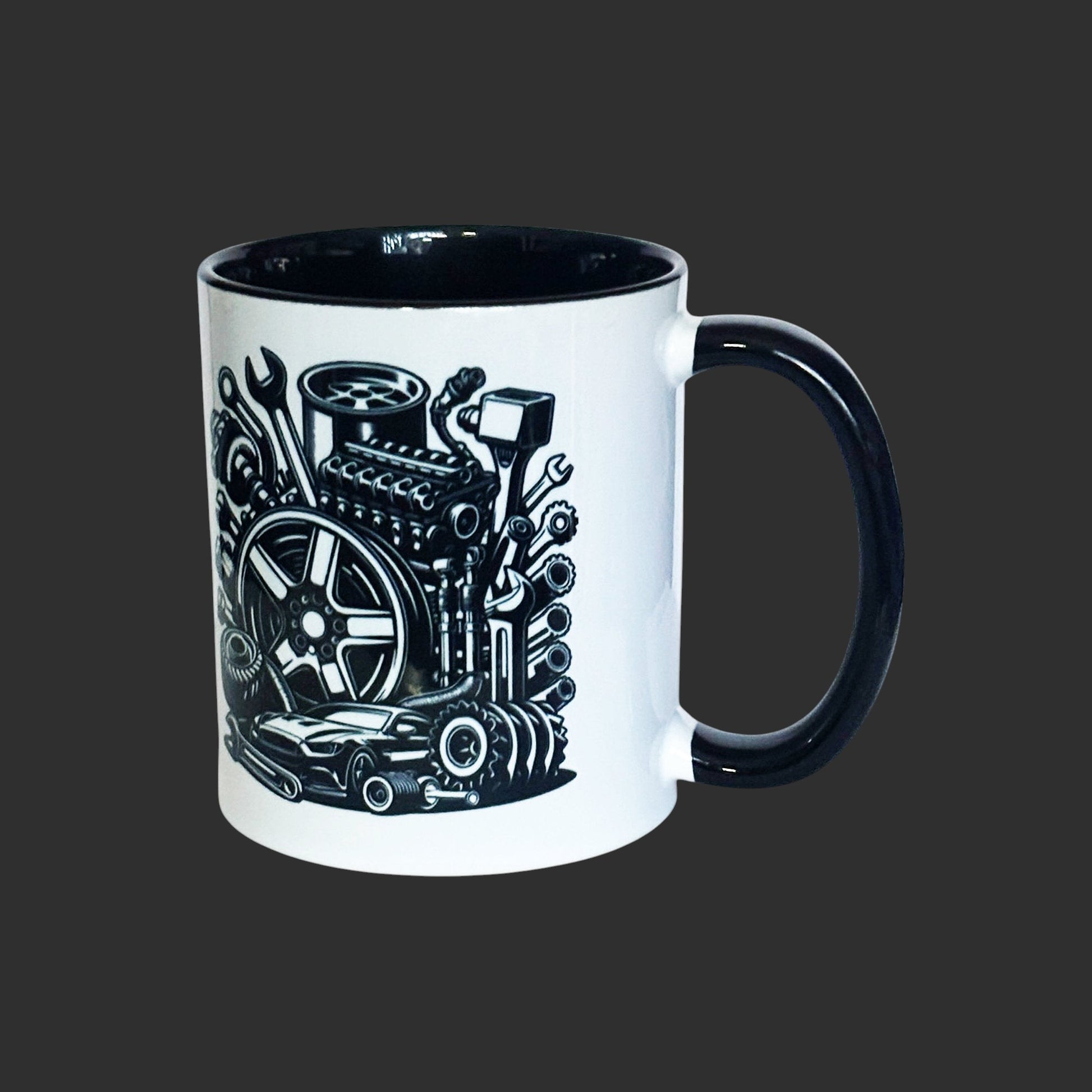 Two-tone black mug with mechanical engine design on a grey background