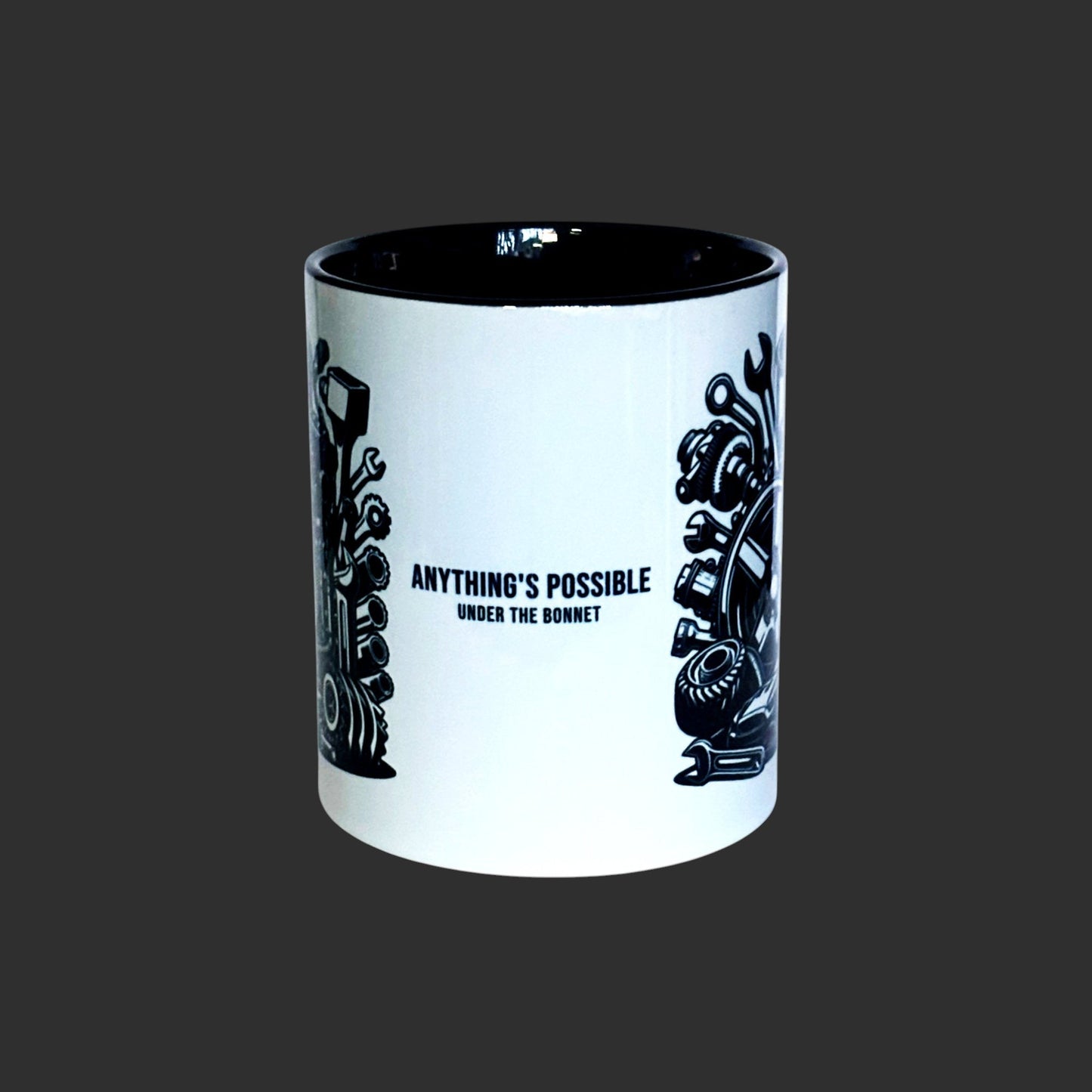 centre view of text anything's possible under the bonnet on black2 tone mug