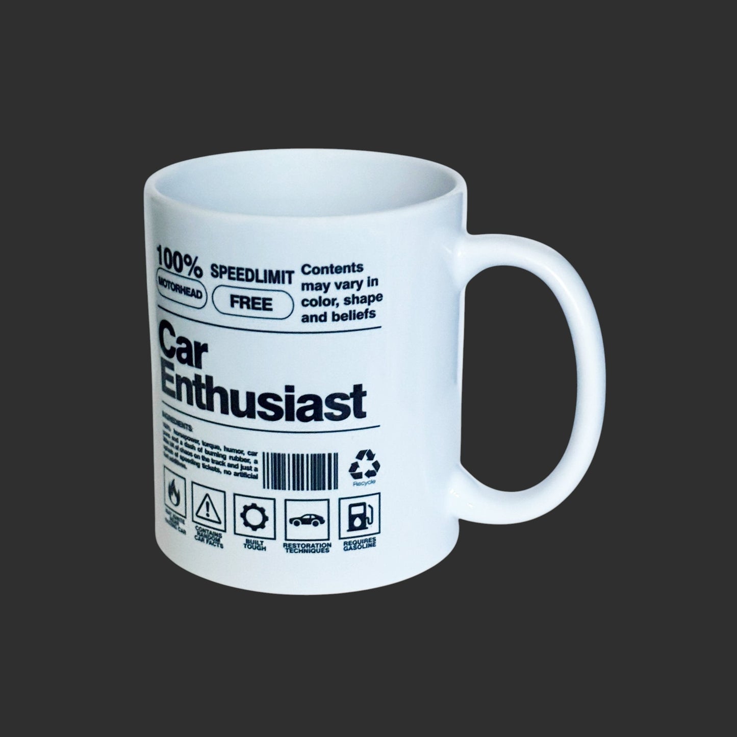 White mug with black text and graphics on a gray background
