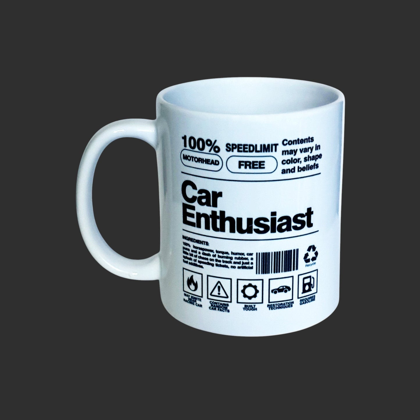 Side view of white ceramic mug with car enthusiast graphic and text