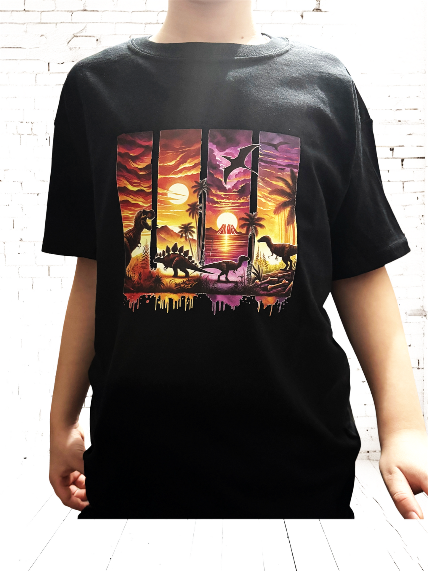 image of dinosaurs on black t shirt worn by model hand printed UK