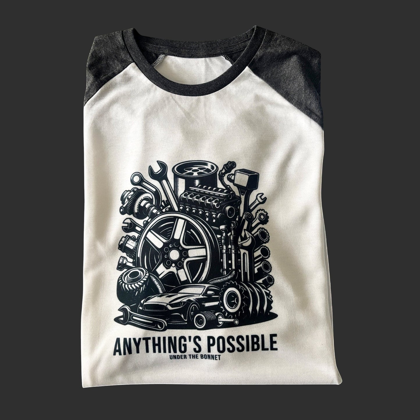 close up of car engine design on charcoal baseball shirt