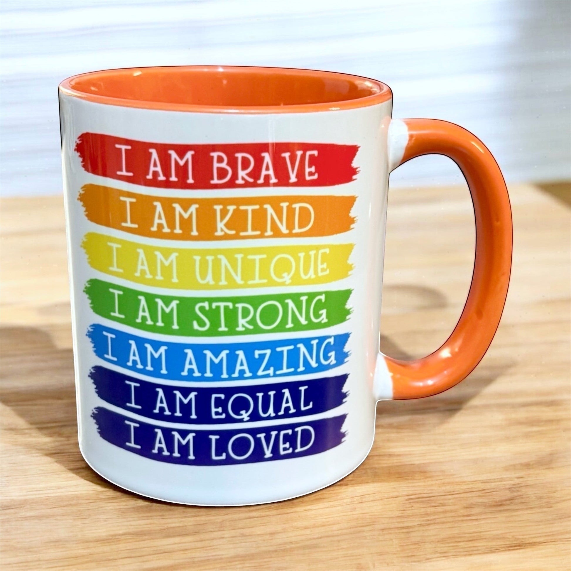 hand printed in the UK 2 tone inner and handle orange Mug with motivational phrases in striking rainbow colours