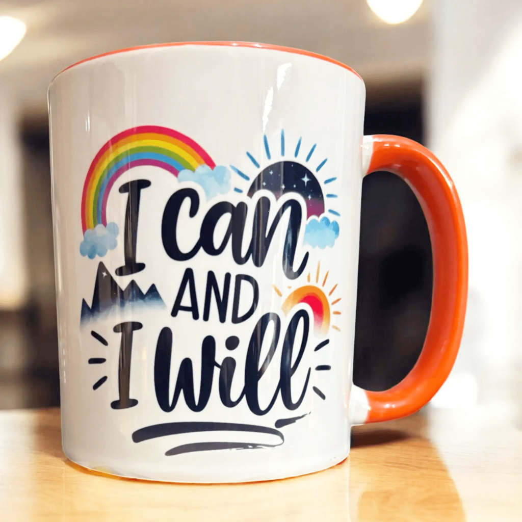 hand printed in the UK orange inner and handle 2 tone ceramic mug with motivational message  close up 