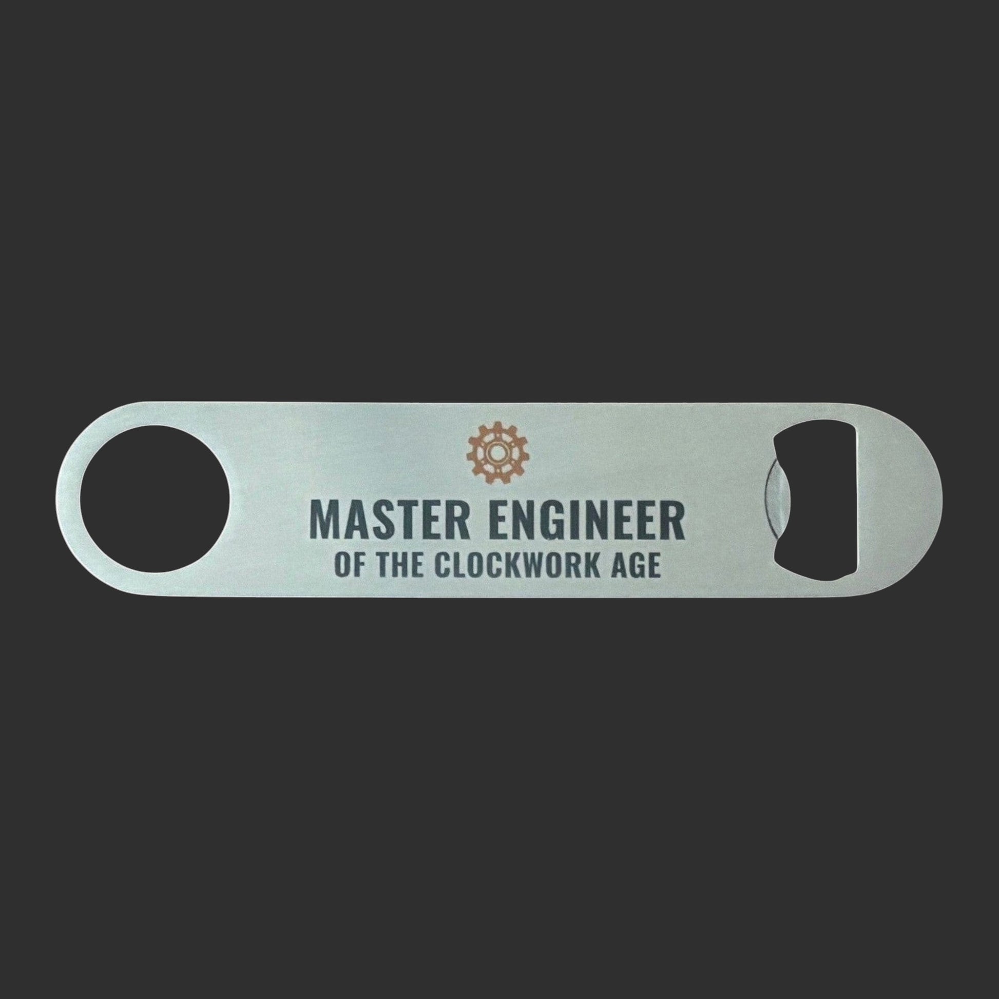 Stainless Steel Bar Blade with Steampunk Cog and Master Engineer Text in black. Bar blade on wooden table.