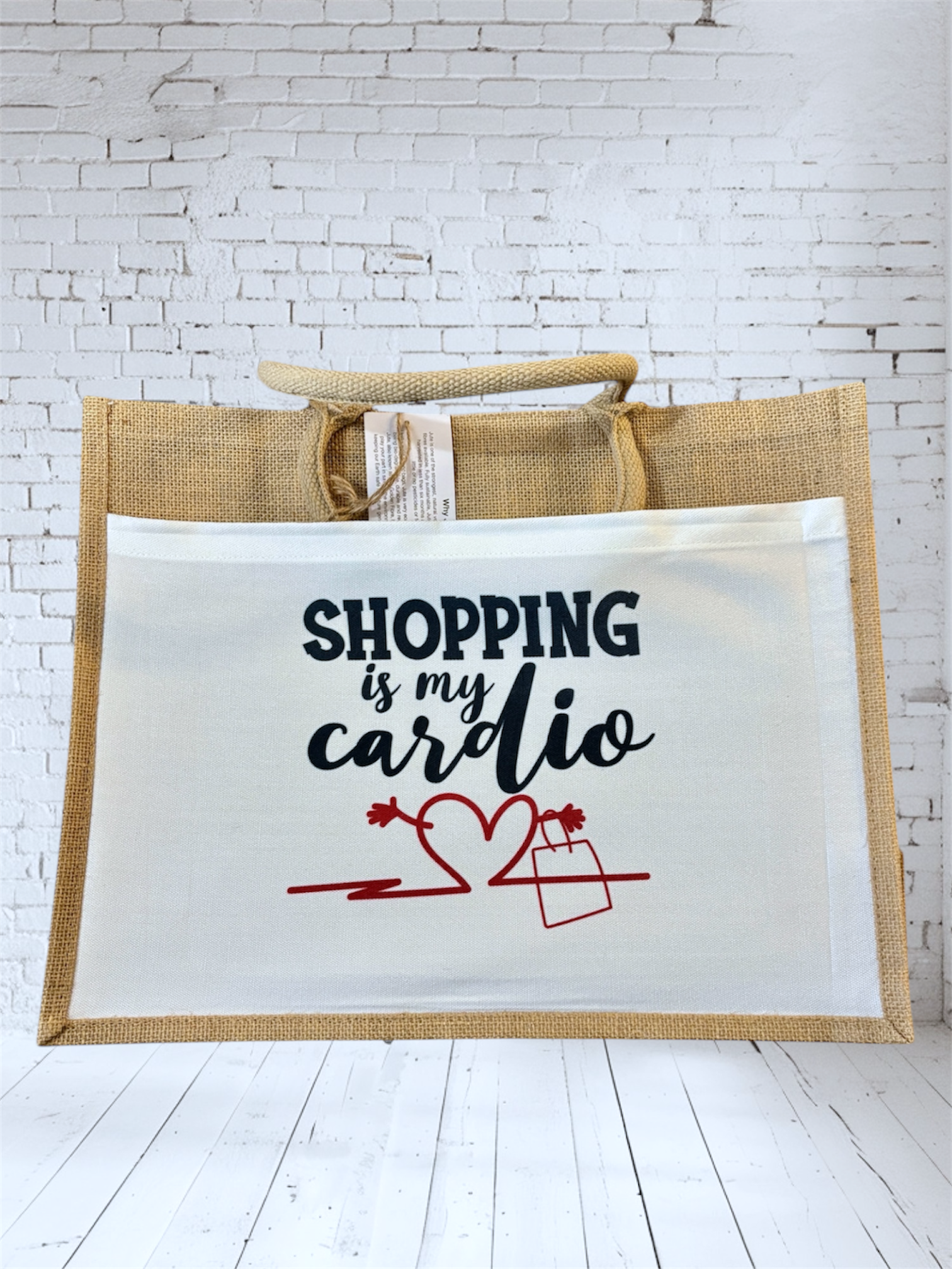 Jute bag with 'Shopping is my cardio' printed on the front white pocket hand printed UK