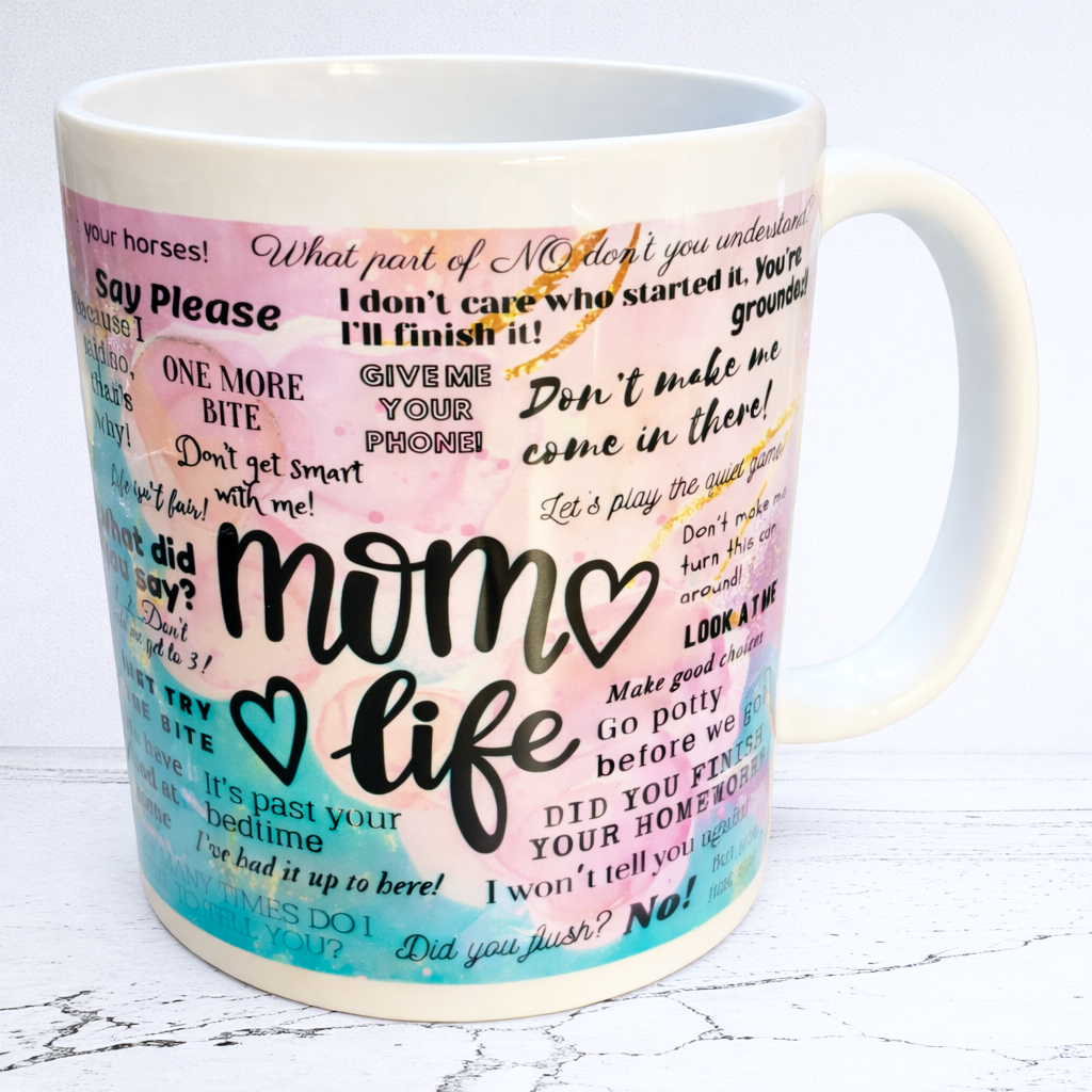 white mug with 'mom life' text and colourful phrases on hand printed UK