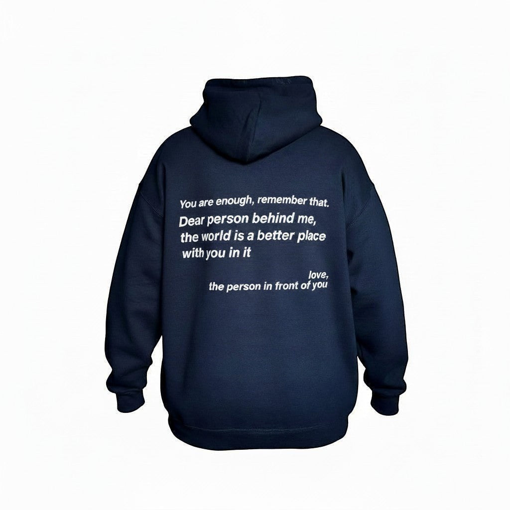 Navy blue hoodie with a motivational quote on the back. Hoodie set against a white background.