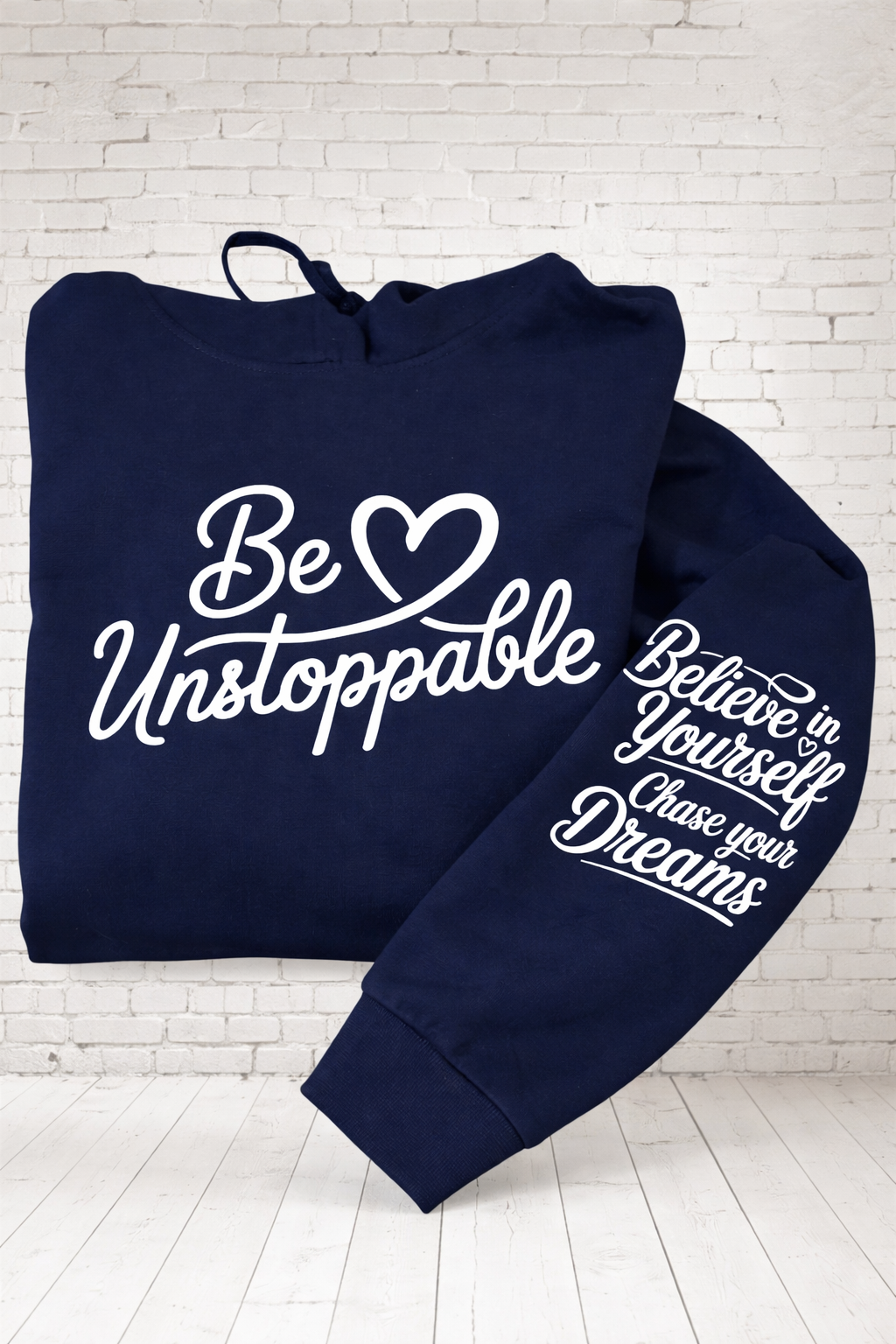 Be Unstoppable navy hoodie with bold motivational text printed on front & sleeve hand pressed UK