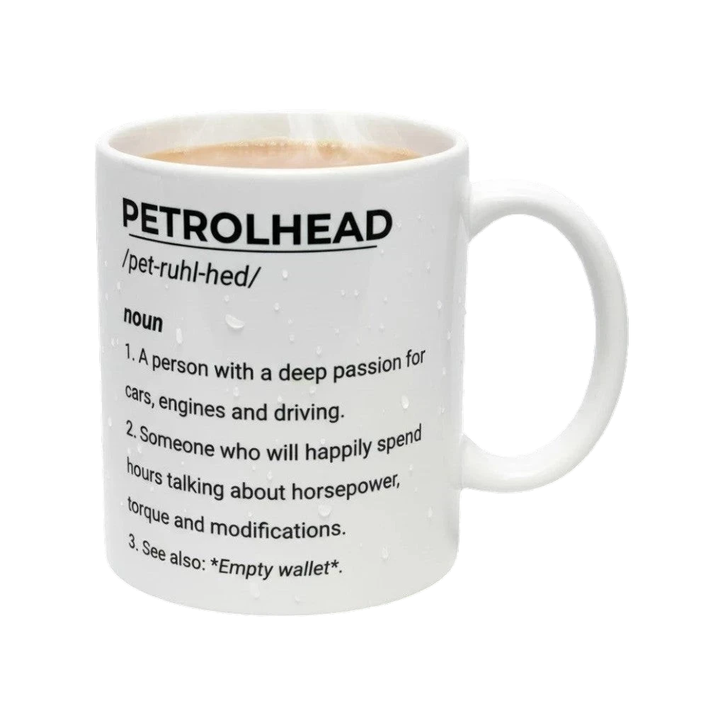 White mug with black text definition of 'petrolhead' on a white background