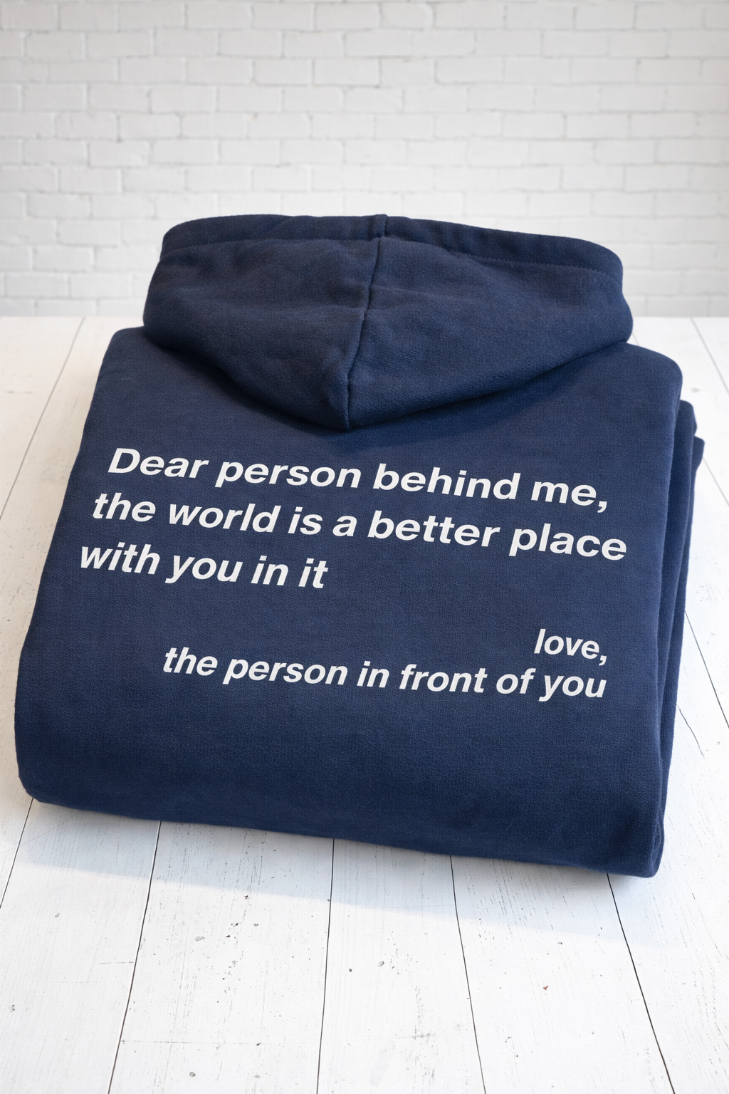 Printed in the UK. Navy blue hoodie with a motivational message 