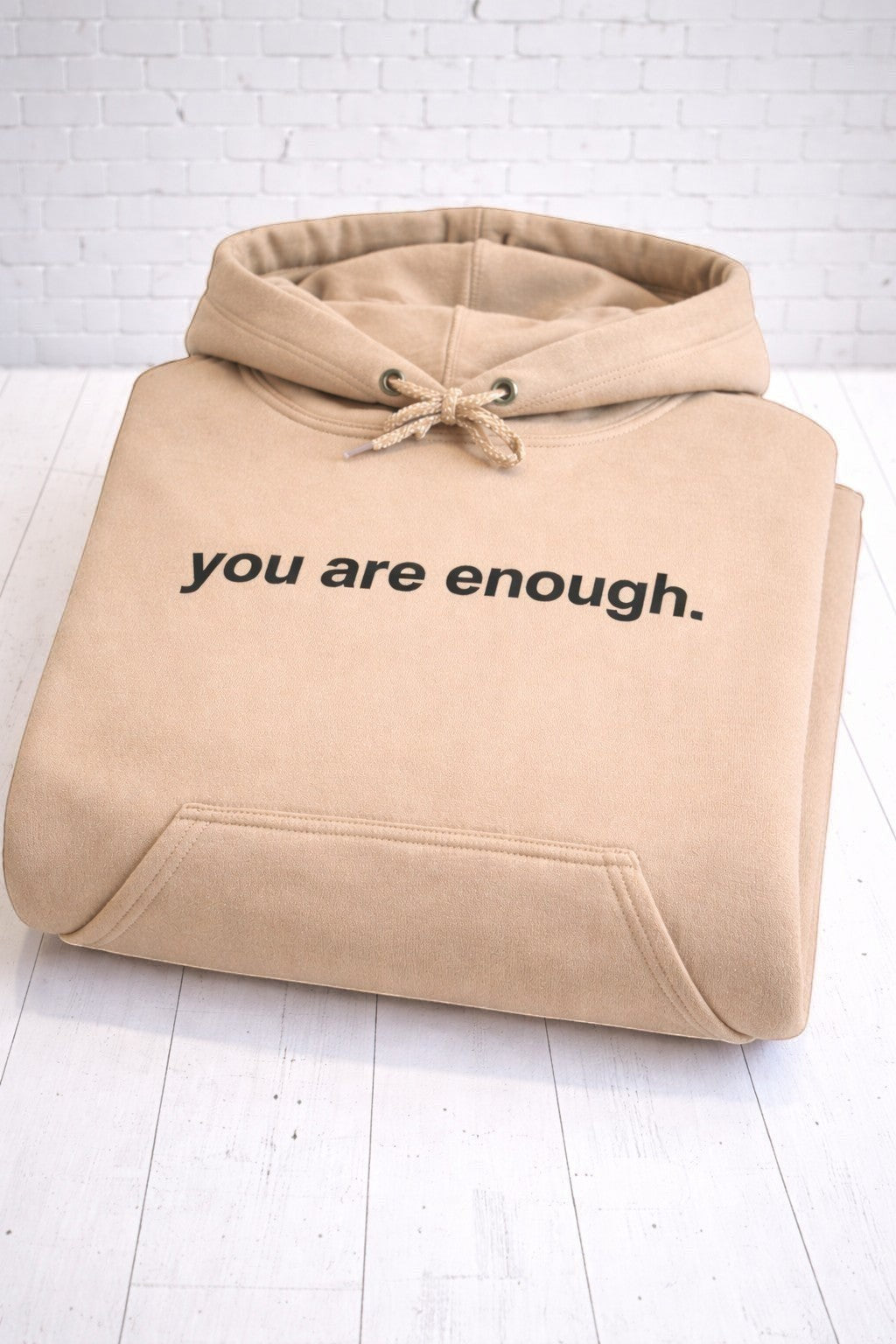 You are enough sand hoodie, folded, front view,. Hand-pressed with care in the UK