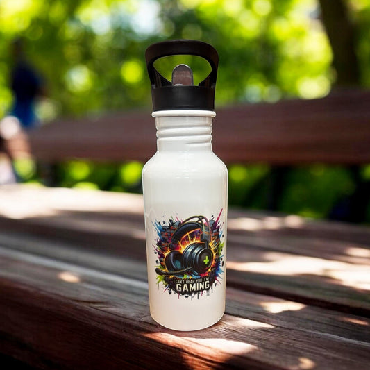 Metal water bottle with gaming design placed on a park bench