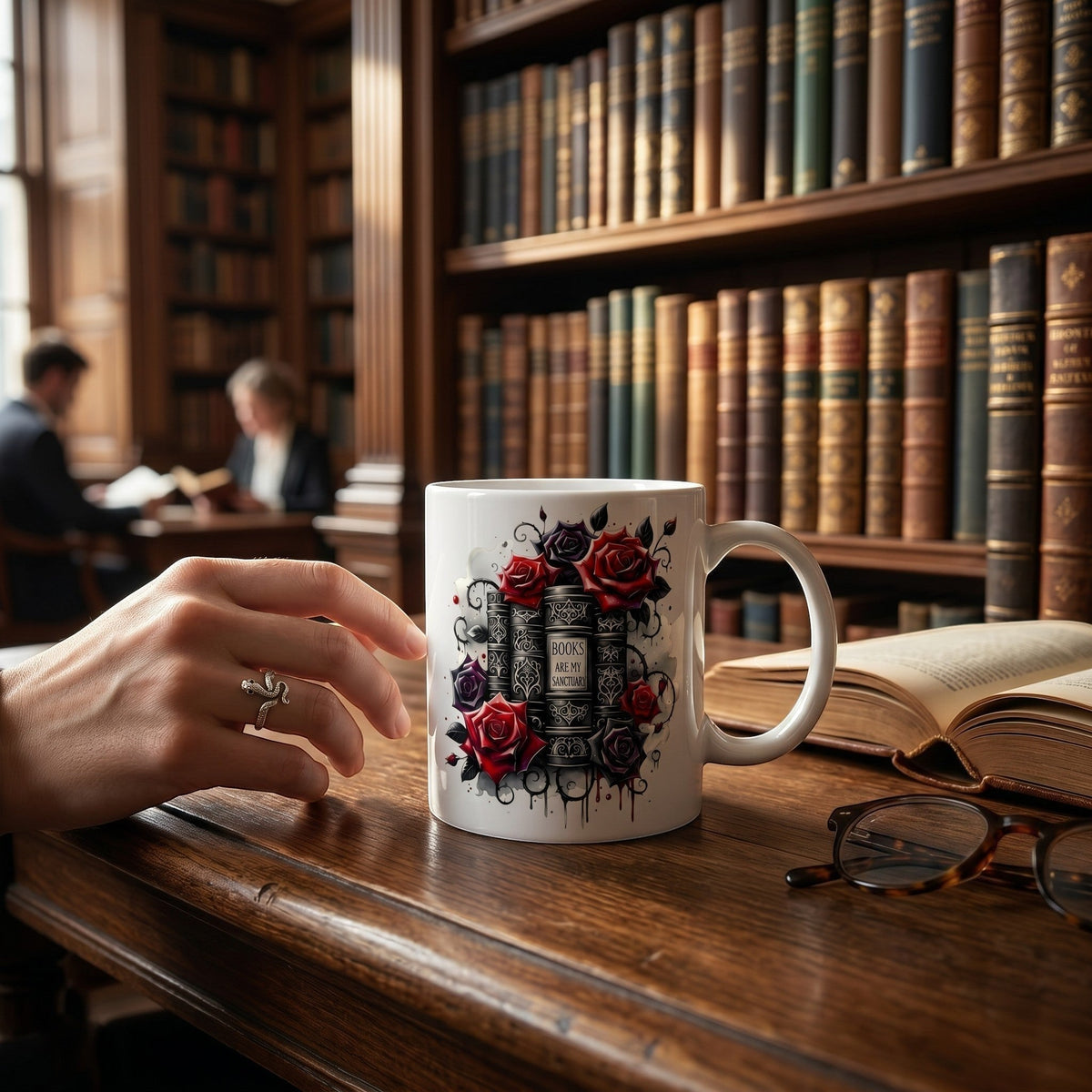 Book lover gift, ceramic mug featuring book stack and red rose artwork on a library desk