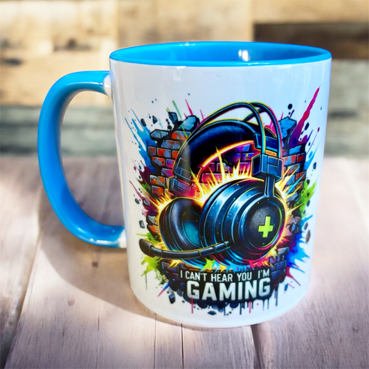 Mug with gaming-themed design and light blue handle hand printed in the UK