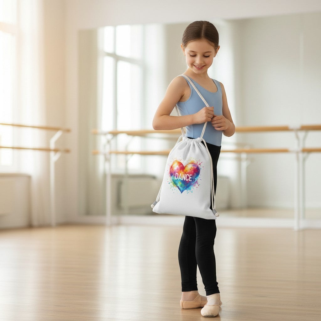 Girl in a dance studio holding a drawstring bag with a colourful heart design.