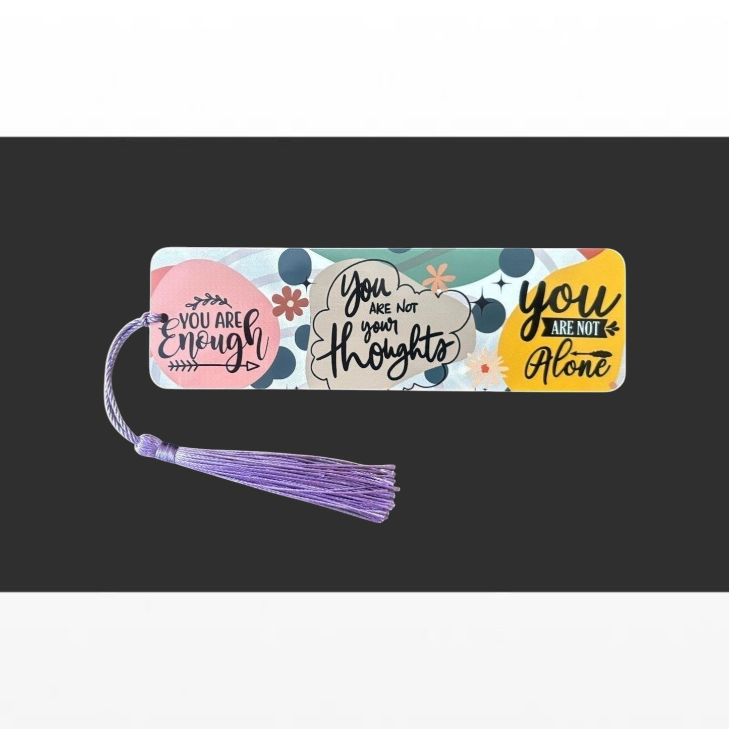 Illustrated Solutions Store metal bookmark with colourful affirmation quotes and a purple tassel for book lovers.