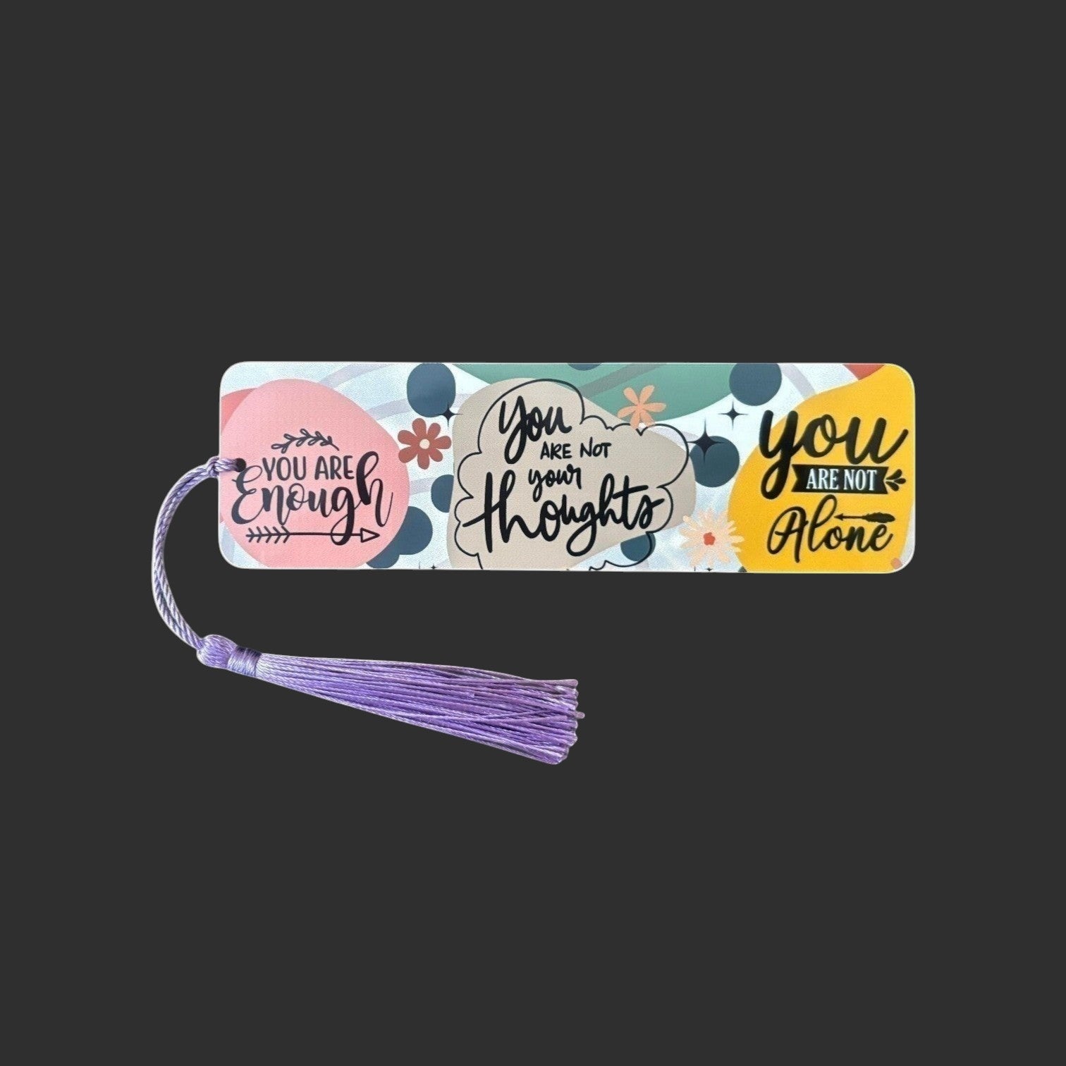 Illustrated Solutions Store metal bookmark with colourful affirmation quotes and a purple tassel for book lovers.