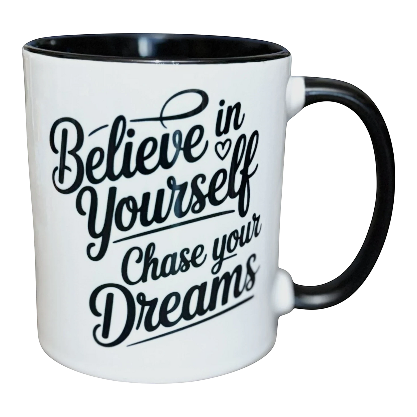 Illustrated Solutions Store white ceramic mug with black interior and handle, featuring black text: Believe in Yourself, Chase your Dreams.
