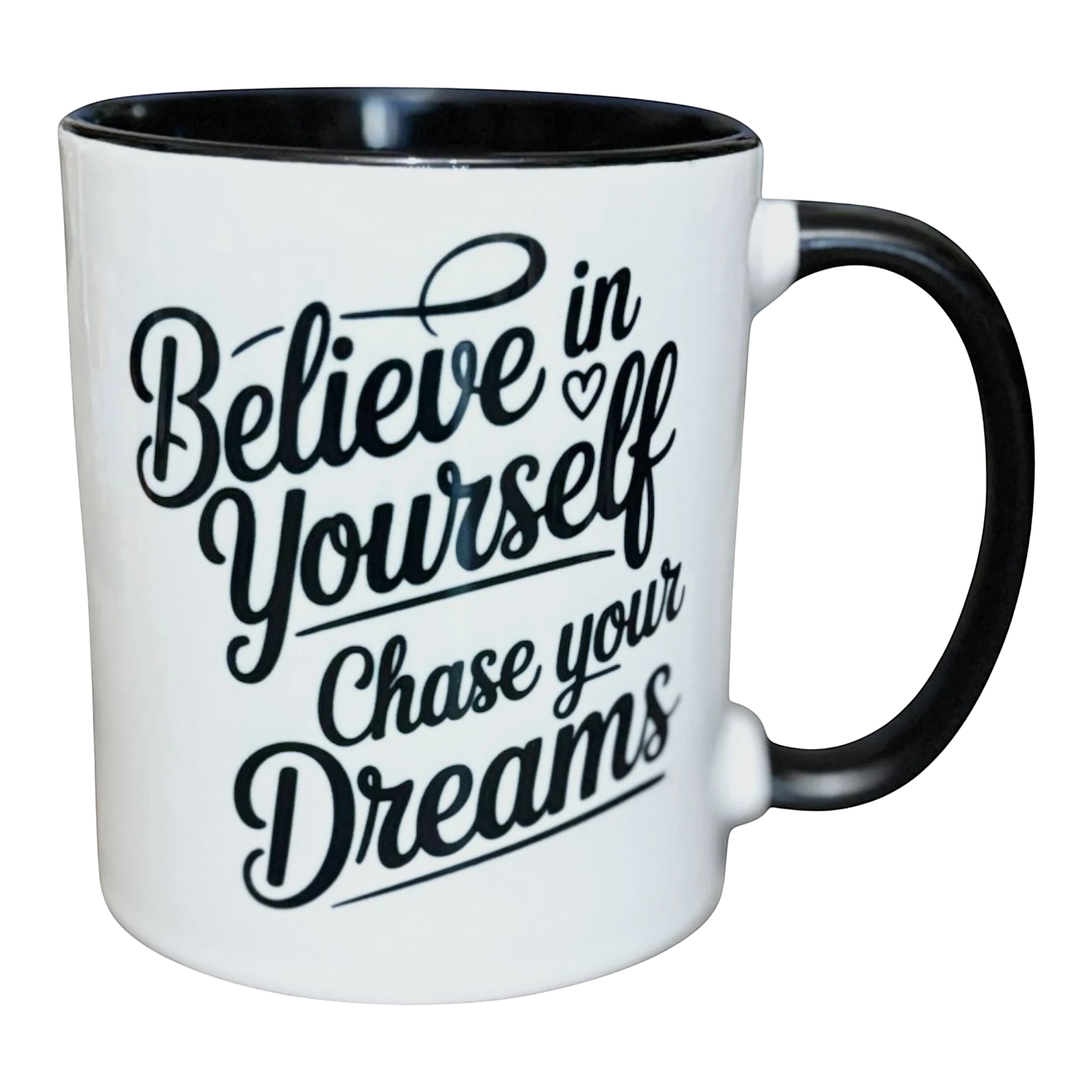 Illustrated Solutions Store white ceramic mug with black interior and handle, featuring black text: Believe in Yourself, Chase your Dreams.