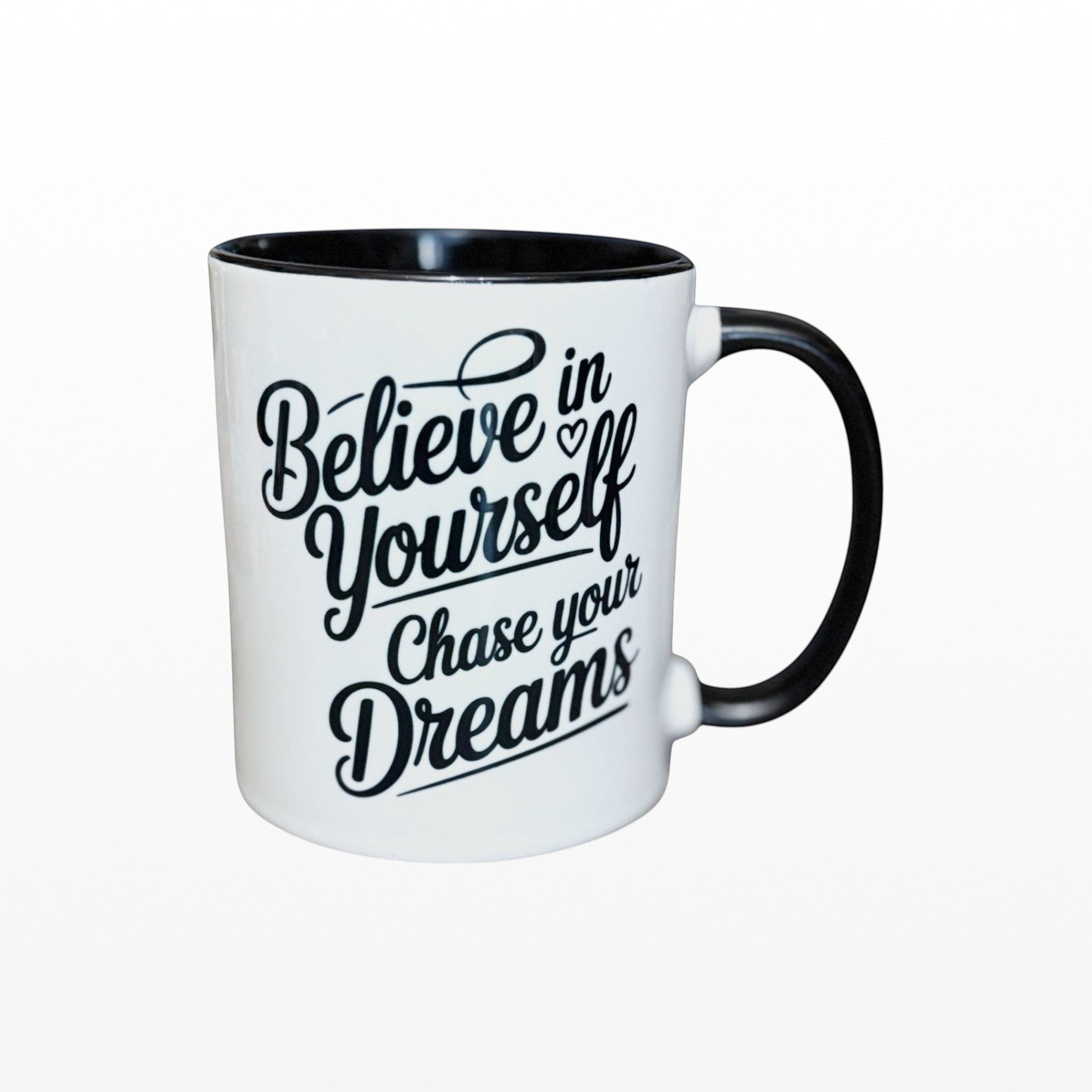 Illustrated Solutions Store white ceramic mug with black interior and handle, featuring 'Believe in Yourself Chase your Dreams' text.