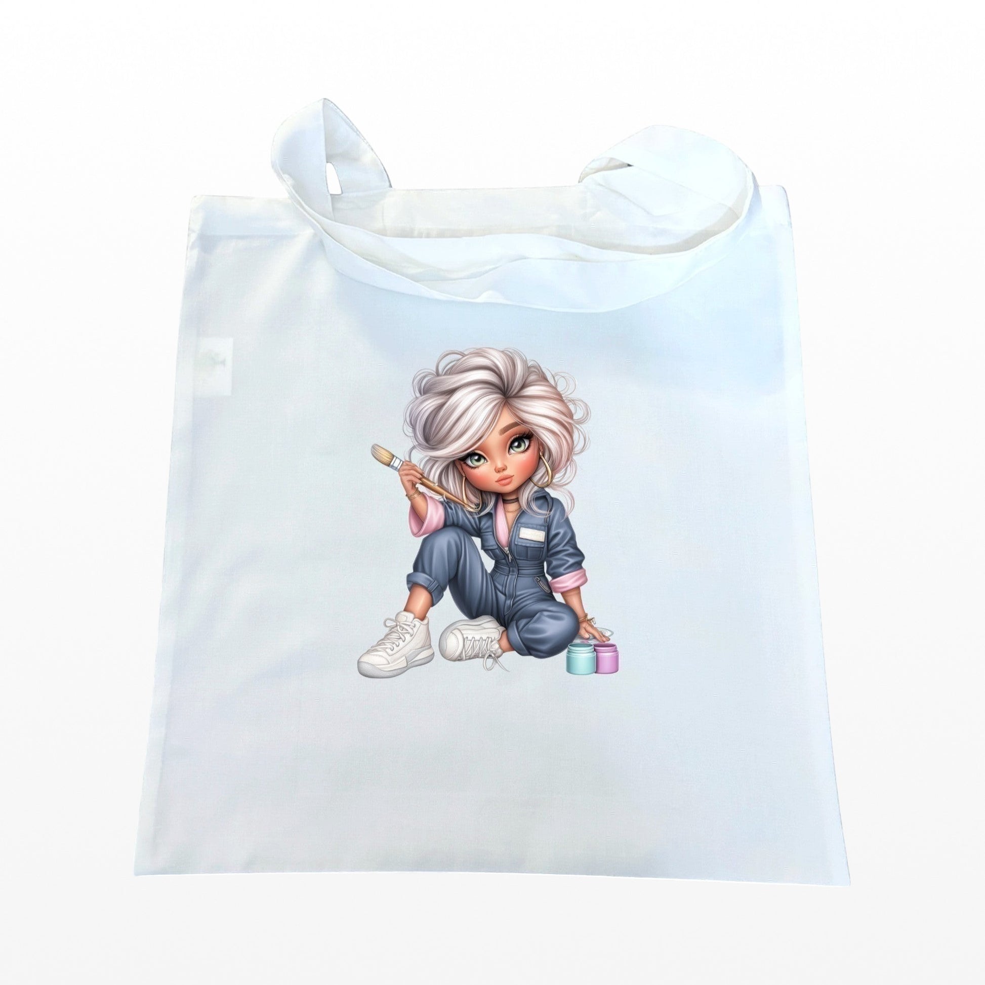 Illustrated Solutions Store white reusable tote bag featuring a cute artist character with a paintbrush and paint pots.