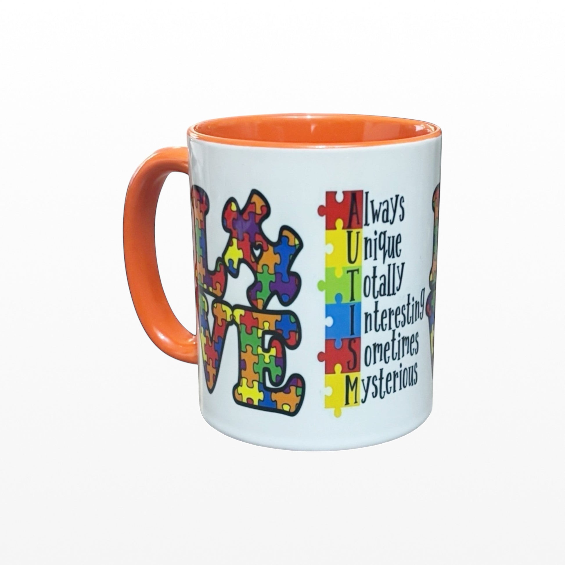 Illustrated Solutions Store 11oz ceramic mug with orange handle and colourful autism awareness puzzle piece design.