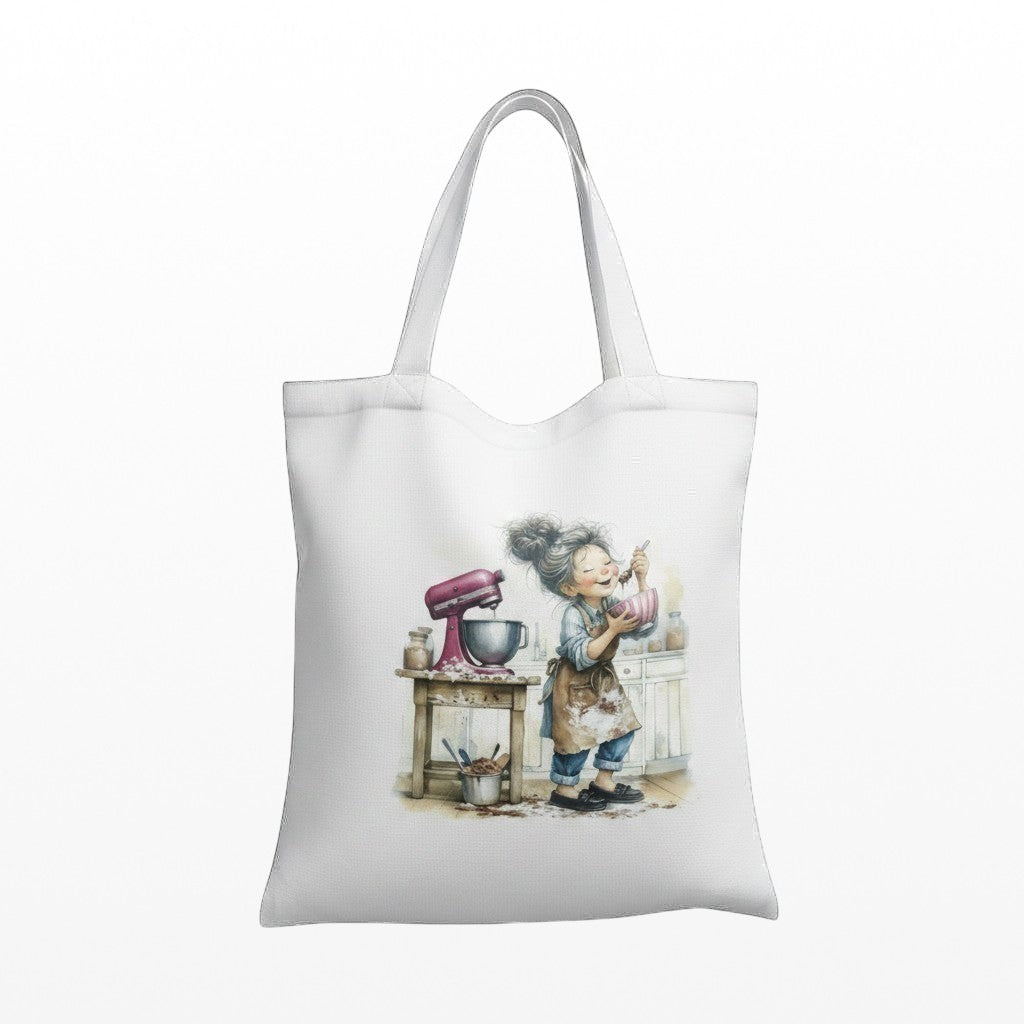 Illustrated Solutions Store white tote bag featuring a cute baking character illustration with a pink mixer.