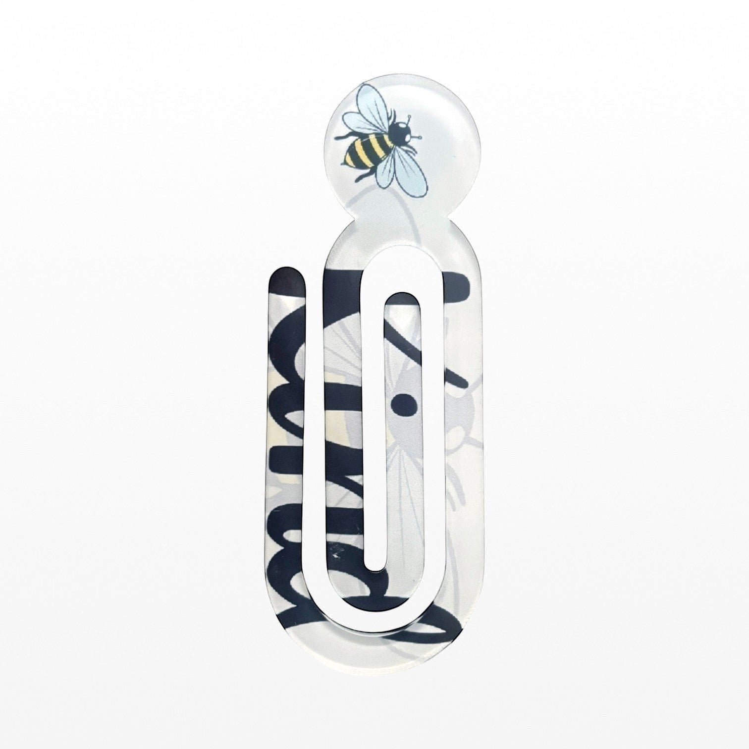 Illustrated Solutions Store acrylic book clip with a bumblebee design and Bee Kind text on a white background large view