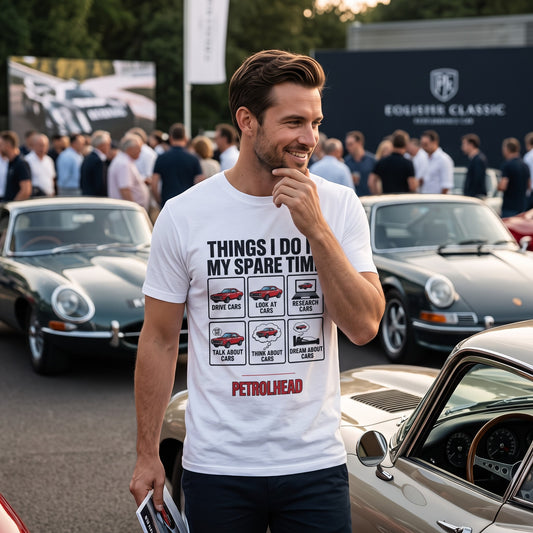 Illustrated Solutions Store white cotton t-shirt with car enthusiast graphic at a classic car show event.