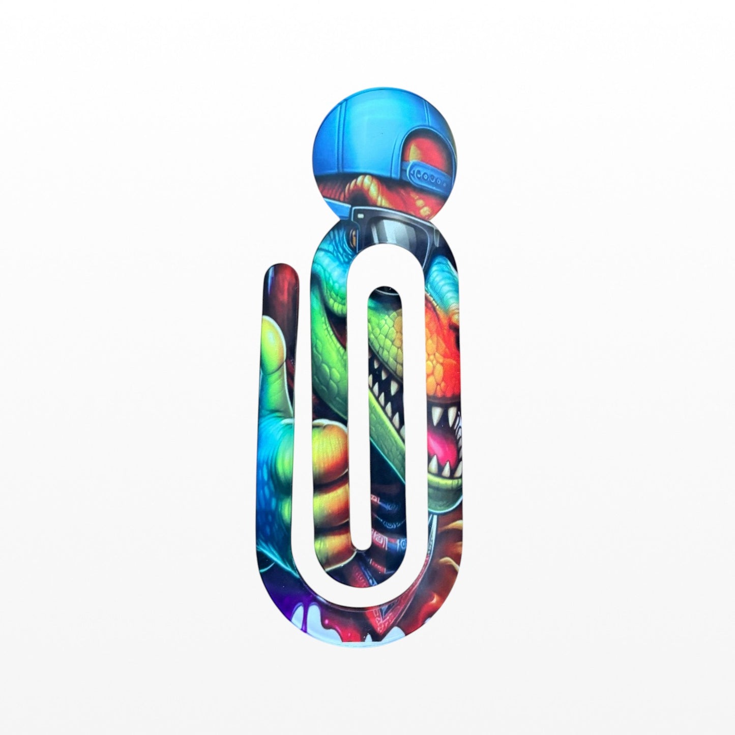 Illustrated Solutions Store dinosaur bookmark clip with blue cap and sunglasses, vibrant colours, perfect for kids.