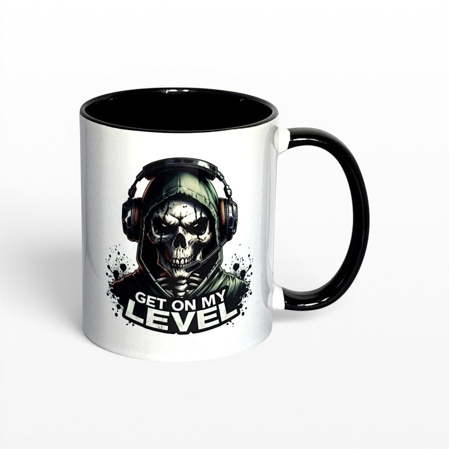 Illustrated Solutions Store white ceramic mug with black interior and handle, featuring a skull gamer design with headset and the text "Get On My Level".