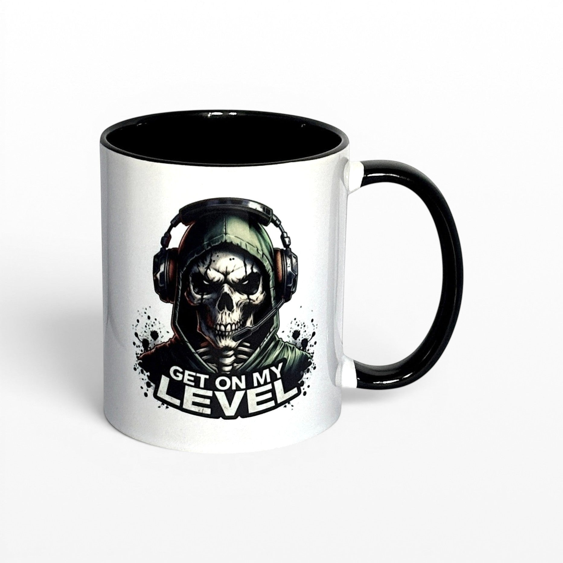 Illustrated Solutions Store white ceramic mug with black interior and handle, featuring a skull gamer design with headset and the text "Get On My Level".