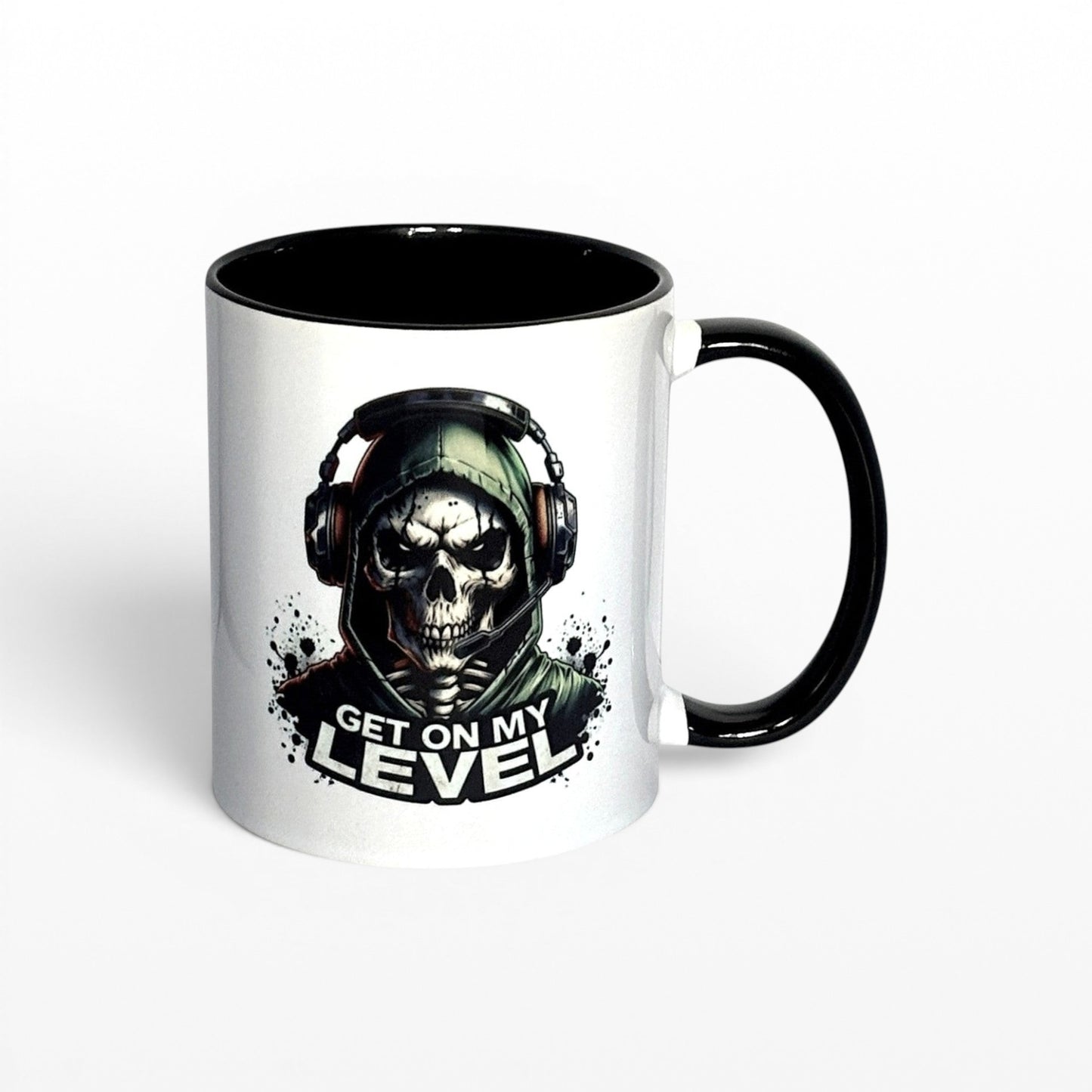 Illustrated Solutions Store white ceramic mug with black handle and interior, featuring a skull gamer design with headset and the text "Get On My Level".