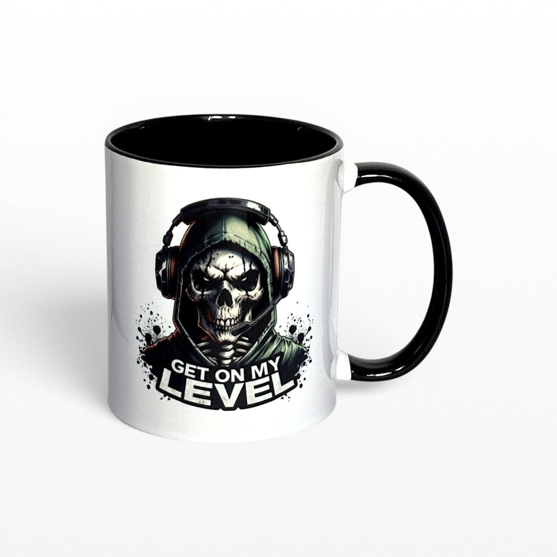 Illustrated Solutions Store white ceramic mug with black handle and interior, featuring a skull gamer design with headset and the text "Get On My Level".